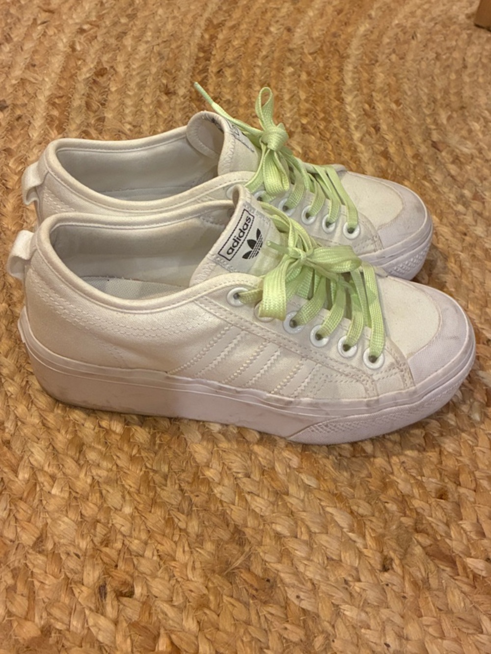 White platform Adidas Nizza sneakers with lime green glow-in-the-dark laces!